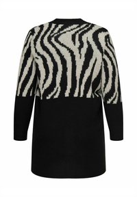 Zwart en crèmekleurig trui met een zebra-streeppatroon, lange mouwen, ronde hals en een zachte brei-structuur, ontworpen voor comfort.