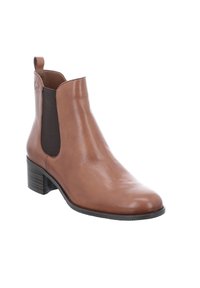 Botte cheville en cuir marron avec des panneaux latéraux élastiques, bout pointu et un petit talon bloc. Texture lisse avec un léger éclat et un détail de logo.