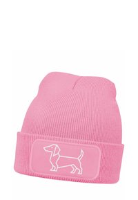 Pink knit beanie with a ribbed texture, featuring a contrasting white dachshund graphic on a rectangular patch at the front.