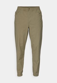 Olivgröna avslappnade byxor med elastisk midja, knäppning med knapp, sidofickor och elastiska muddar vid anklarna.