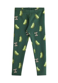 Grønne leggings med et gentaget ærtebelg-mønster og sætningerne "PEAS & LOVE" i pink. Fremstillet af blødt, strækbart materiale.
