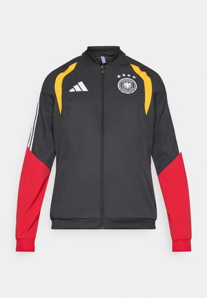 Czarna kurtka z czerwonymi i żółtymi akcentami, z trzema białymi paskami na rękawach oraz emblematem niemieckiej drużyny na piersi, wykonana z lekkiego materiału.