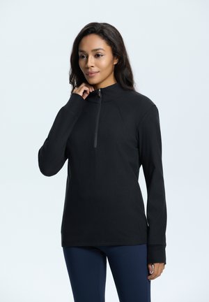 Zwarte zip-up top met een hoge kraag, lange mouwen en een gladde stofstructuur, met een korte rits aan de voorkant en een getailleerd ontwerp.