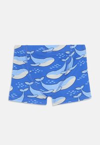 Blue boxer shorts featuring a repeated whale pattern in light blue, cream, and white, made from soft, stretchy fabric.