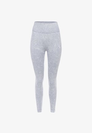 Pelēkas sportiskas legingi ar ribotu augsto jostasvietu, mīkstu tekstūru un smalku svītrainu rakstu. Satur mazu logo sānos.