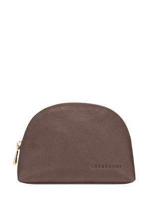 Brown leather pouch with a rounded top, featuring textured surface and gold zipper. "LONGCHAMP" logo embossed on the front.