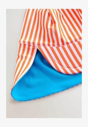 Next Naģene - orange