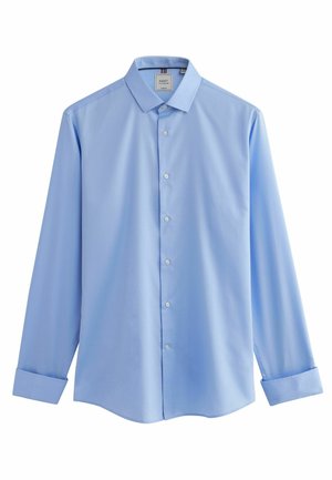 Lyseblå skjorte med knapper lavet af glat stof, med spidse krave, lange ærmer og buet kant. Fem knapper ned ad fronten.