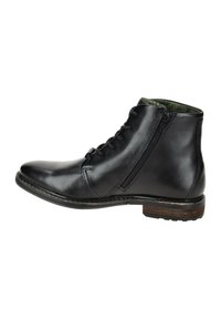 Schwarze Leder-Stiefelette mit Schnürung vorne und seitlichem Reißverschluss. Hat ein strukturiertes grünes Futter und einen gestapelten Holzabsatz.