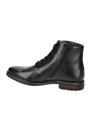 Schwarze Leder-Stiefelette mit Schnürung vorne und seitlichem Reißverschluss. Hat ein strukturiertes grünes Futter und einen gestapelten Holzabsatz.