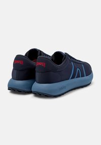 Navy and light blue sneakers feature a smooth fabric upper, combined textures, and a solid heel counter with embossed brand logo.