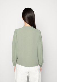 JDY LION LIFEL/S PLACKET - Blusa - sea spray
