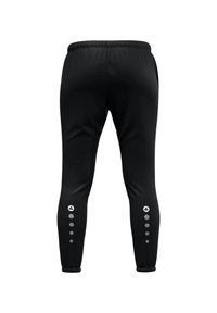 Pantalons de sport noirs avec une taille élastique, des jambes fuselées et des accents réfléchissants le long des côtés extérieurs avec des motifs circulaires.