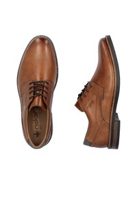 Scarpe in pelle marrone con accenti texturizzati, punta arrotondata, allacciatura frontale e cuciture in contrasto; presentano suola in gomma e interno imbottito.