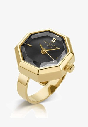 Goldfarbener achteckiger Chronograph mit schwarzem strukturiertem Zifferblatt, goldenen Zeigern und leicht erhöhten Markierungen. Verfügt über ein poliertes goldfarbenes Armband und eine seitliche Krone.