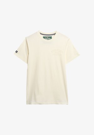 Cremefarvet bomulds T-shirt med rund hals, korte ærmer og præget "Superdry" logo på venstre side. Standard pasform.