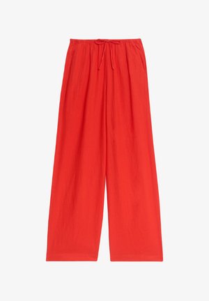 Red wide-leg pants with an elastic waistband and drawstring. Made from soft fabric with a smooth texture. No pockets or patterns.
