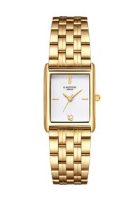 Kuldne ristkülikuline kell tekstuuriga valge sihvkega, kuldsed käed ja võrgusilmast käevõru. Kaubamärk ja logo on kuvatud sihvel.