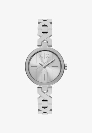 Relógio analógico prateado com um mostrador redondo, textura em relevo e design minimalista. Apresenta uma bracelete geométrica ligada e um logótipo gravado.