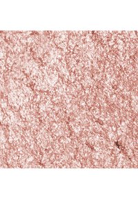 Close-up van glinsterende roségouden glitters die dicht op elkaar het oppervlak bedekken met gevarieerde lichtreflecties.