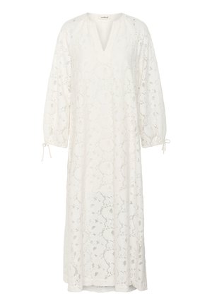 White lace dress with a V-neck, long puff sleeves, and ties at the cuffs. Features intricate floral patterns throughout.