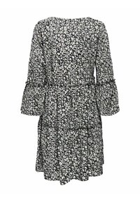 Vestido con patrón floral en blanco y negro, con escote redondo, mangas de campana largas y diseño de dobladillo en capas. Tejido ligero.