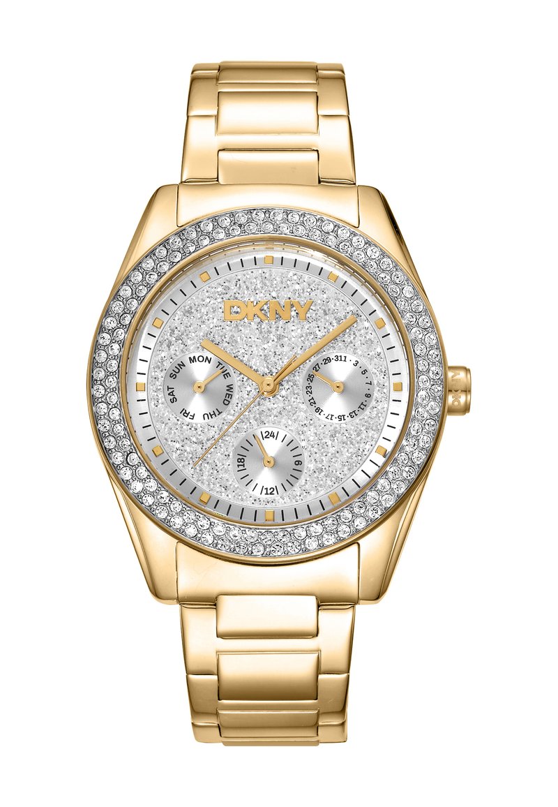 Orologio dorato con quadrante argento testurizzato scintillante, tre sottodial e una lunetta accentuata da cristalli. Bracciale a maglie metalliche. Marca: DKNY.