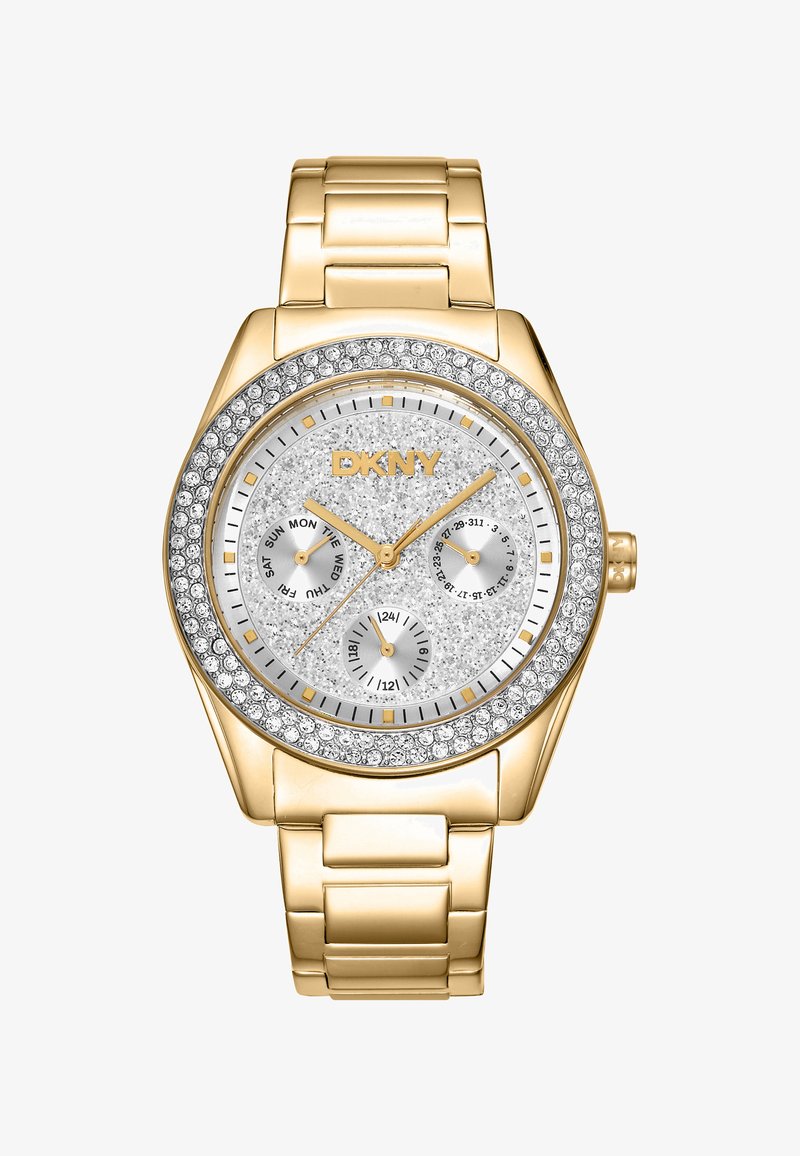 Orologio dorato con quadrante argento testurizzato scintillante, tre sottodial e una lunetta accentuata da cristalli. Bracciale a maglie metalliche. Marca: DKNY.