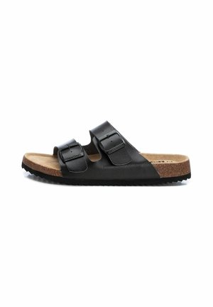 Sandalias de cuero negro con dos correas ajustables, plantilla de corcho y suela de goma texturizada. Presenta un acabado suave y una construcción resistente.