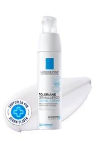White pump bottle of La Roche-Posay Toleriane Dermallergo moisturizing cream with cream smear and dermatologist recommendation icon.