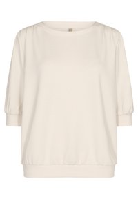 Camisa de color crema de manga corta con puños y dobladillo elásticos, escote redondo y un corte holgado.