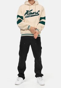 Karl Kani Jersey con capucha - beige