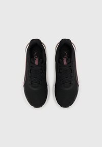 Black athletic shoes with mesh upper, pink accents, and lace closure. Features cushioned sole and PUMA logo on tongue and side.