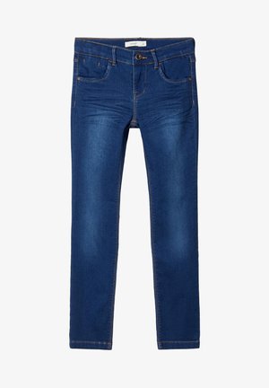 Jean slim bleu foncé avec poches avant, passants pour ceinture, fermeture par boutons et légère décoloration sur l'avant des cuisses.