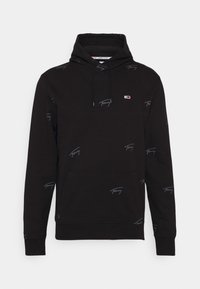 Sudadera negra con capucha, que cuenta con un bolsillo frontal y un patrón repetido de logotipos en gris. Fabricada con un tejido suave y con puños acanalados.