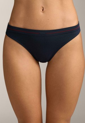 Navy blue ribbed fabric bikini with a red accent band at the waist, featuring a low-rise cut and smooth texture.