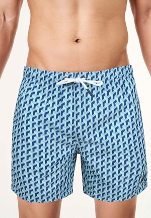 Blaue Badehose mit einem geometrischen Muster in dunklerem Blau, ausgestattet mit einem elastischen Bund und einer weißen Kordel.