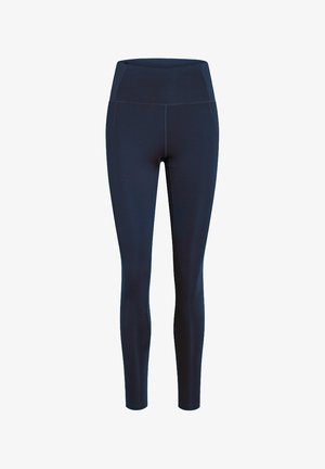 Granatowe legginsy z wysokim stanem i pełną długością, z płaskimi szwami i szerokim pasem, zaprojektowane do noszenia sportowego lub casualowego.