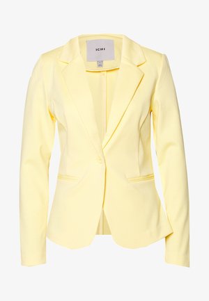 Žlutý oblekový blejzr s klopami, dvěma předními kapsami a zapínáním na jedno tlačítko. Vyrobený z hladké tkaniny se strukturovaným střihem.