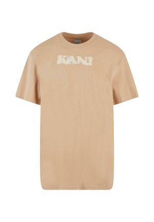 Beige pamut póló rövidujjakkal, kerek nyakkivágással, középen világos színű "KANI" grafikával. Puha tapintású, laza fazonú.
