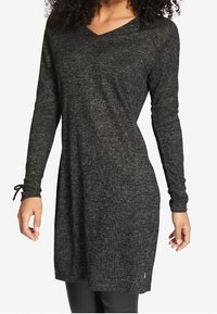 Langärmliges V-Neck-Tunikakleid aus schwarzem Melange-Stoff mit lockerer Passform und subtiler Textur. Mit Kordelzugdetails an den Bündchen.