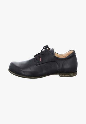 Black leather shoe with rounded toe, lace-up design, and a low stacked heel. Features a smooth texture and subtle stitching detail.