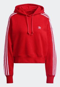 Red hooded sweatshirt made of cotton blend, featuring white horizontal stripes on sleeves, adjustable drawstrings, and a small logo on the chest.