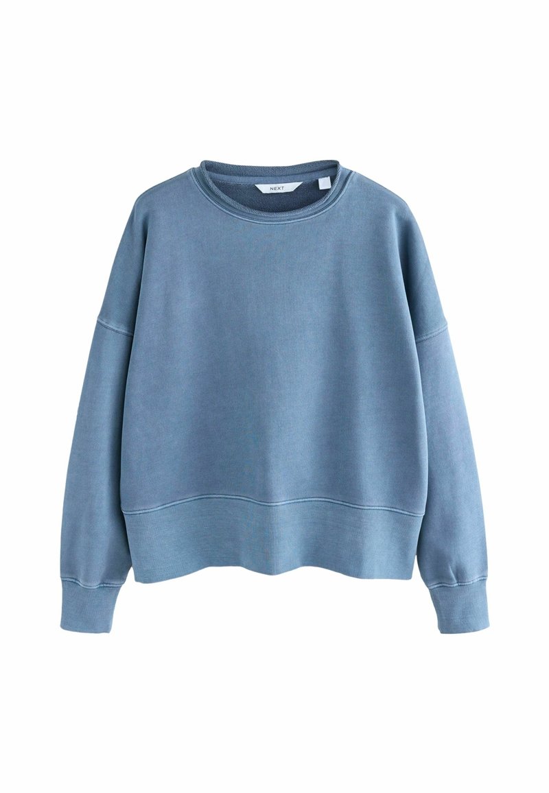 Sudadera corta azul de tejido suave; cuenta con cuello redondo, hombros caídos y puños y dobladillo acanalados.