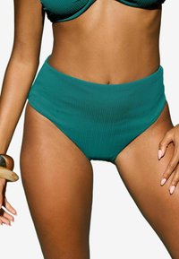 Visoke tealske bikini hlačke z žametno teksturo in širokim pasom, ki imajo gladek zaključek in visok izrez ob nogah.