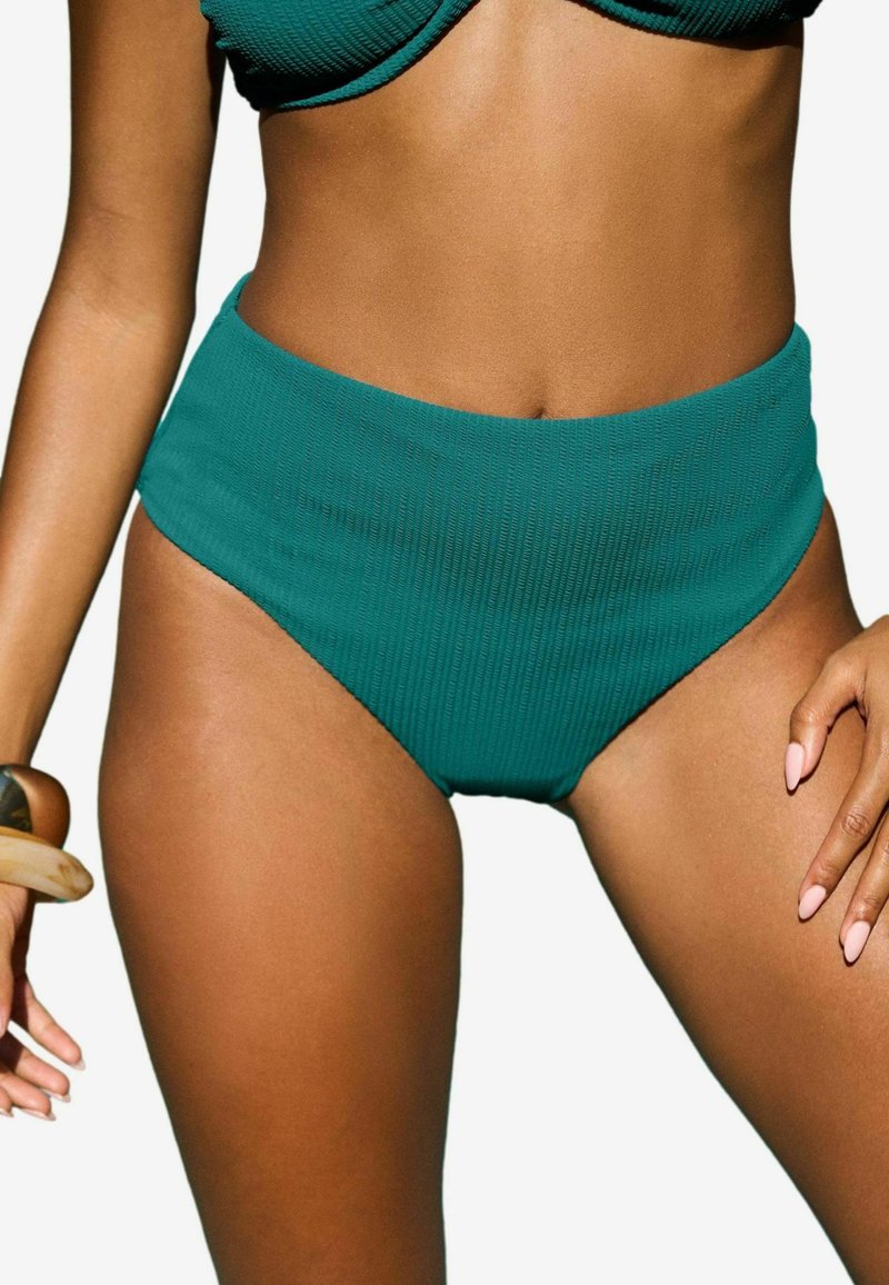 Visoke tealske bikini hlačke z žametno teksturo in širokim pasom, ki imajo gladek zaključek in visok izrez ob nogah.