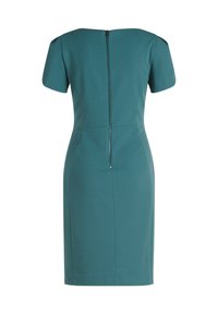 Robe courte teal à manches courtes avec une silhouette ajustée, fermeture éclair au dos et épaules structurées. Texture de tissu lisse sans motifs visibles.