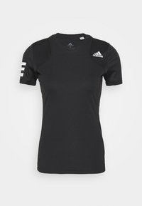 Mustapaitainen lyhythihainen urheilupaita, jossa on valkoinen Adidas-logo, kolme raitaa hihassa ja tekstuuriset olkapaneelit. Kevyt kangas.