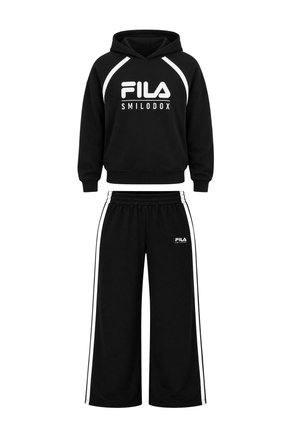 Two children wearing black FILA hoodies and matching pants, standing side by side with hands in pockets and one child's arm resting on the other's shoulder.