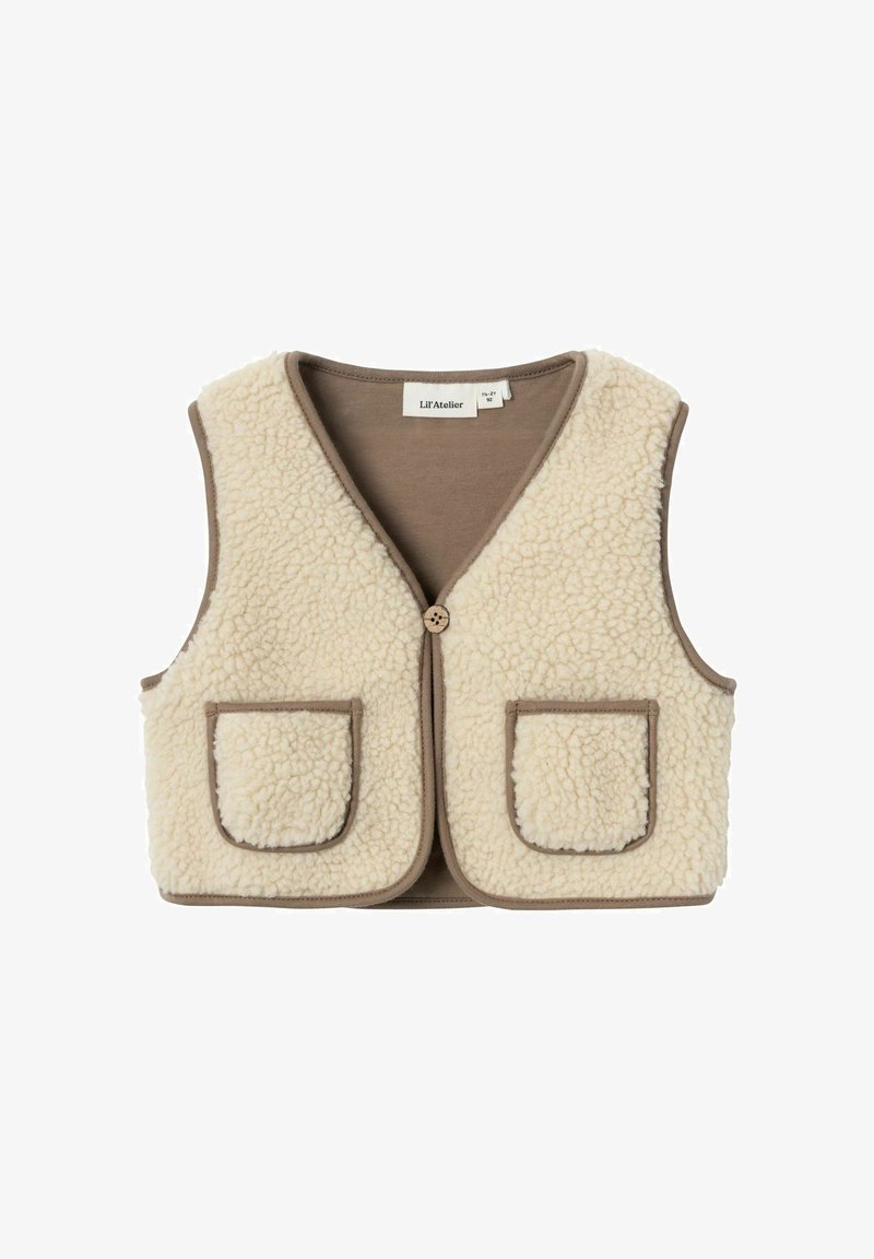 Bež flis brezrokavnik z V-izrezom, rjavim obrobom in dvema sprednjima žepoma. Ima en gumb za zapiranje. Mehak material, sproščen dizajn.